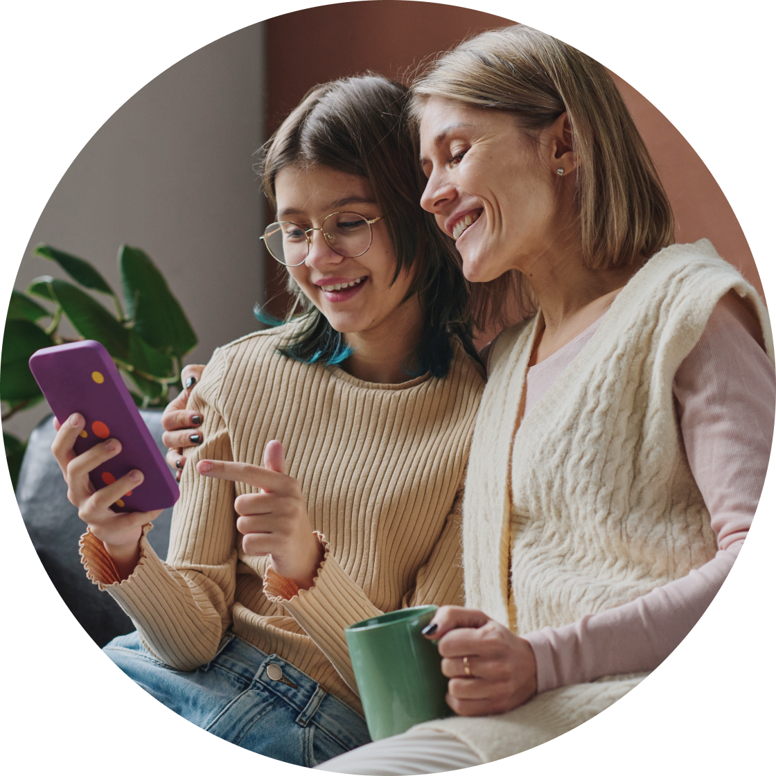 Mother and daughter looking at cell phone
